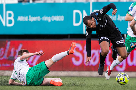 Petter Vaagan Moen of HamKam tackles Erixon Danso of