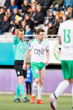 Petter Vaagan Moen of HamKam is shown a yellow card by