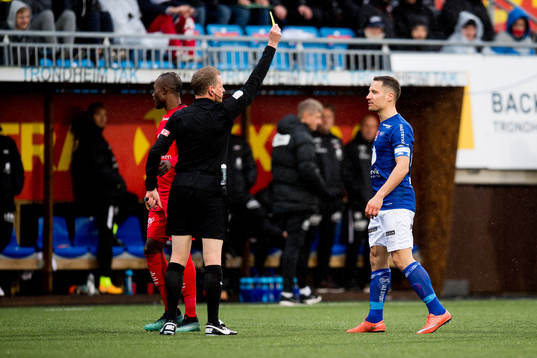 Mads Reginiussen of Ranheim is given a yellow card by