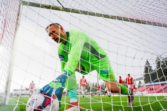 Goalkeeper Simon Thomas of Kongsvinger picks the ball out