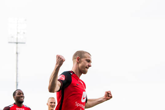 Peter Orry Larsen of Brann celebrates with his teammates