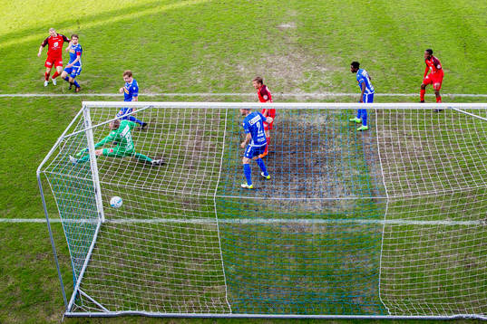 Peter Orry Larsen of Brann scores 0-1 behind goalkeeper
