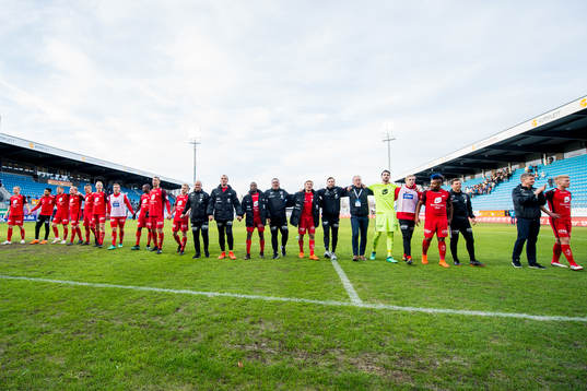 Players and staff of Brann celebrate