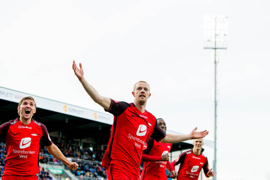 Peter Orry Larsen of Brann celebrates with teammates