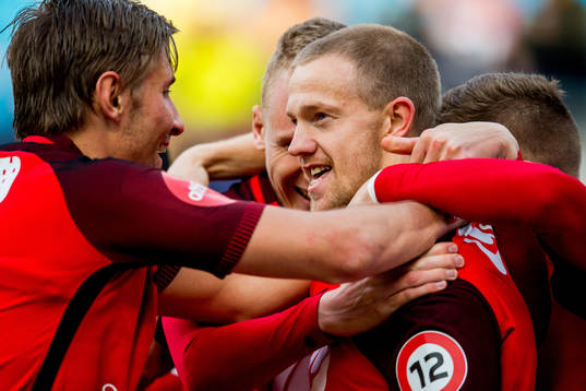 Peter Orry Larsen of Brann celebrates with teammate Steffen
