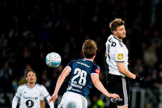 Marius Høibråten of Strømsgodset and Nicklas Bendtner of