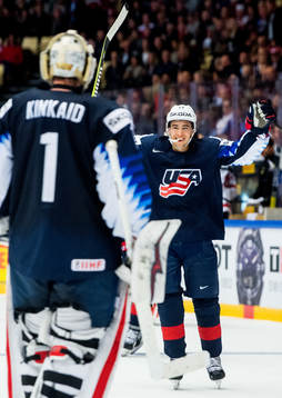 Johnny Gaudreau of USA celebrates with teammate and