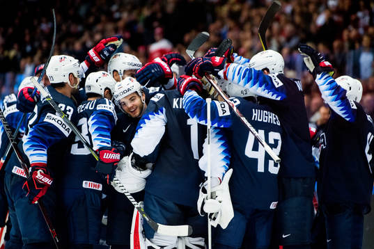 Alex DeBrincat of USA celebrates with teammates