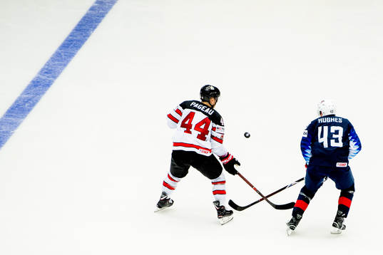 Jean-Gabriel Pageau of Canada and Quinn Hughes of USA