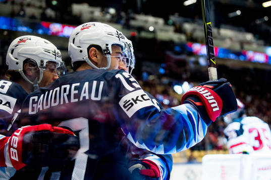 Johnny Gaudreau of USA celebrates with teammates