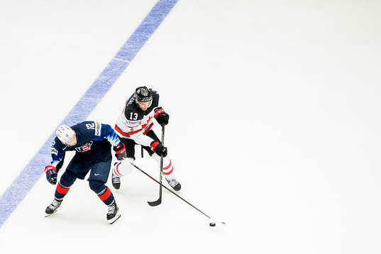 Alex DeBrincat of USA and Matt Barzal of Canada