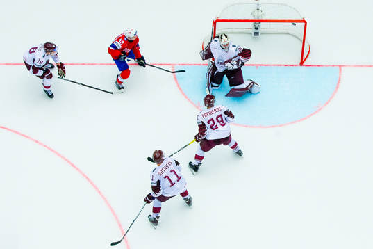Ken Andre Olimb of Norway sees a shot hitting the post