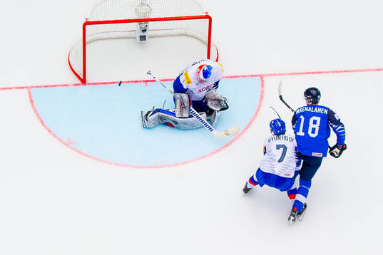 Saku Maenalanen of Finland shoots past Hyonho Oh and
