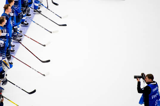 Players of Finland is taken pictures of by IIHF