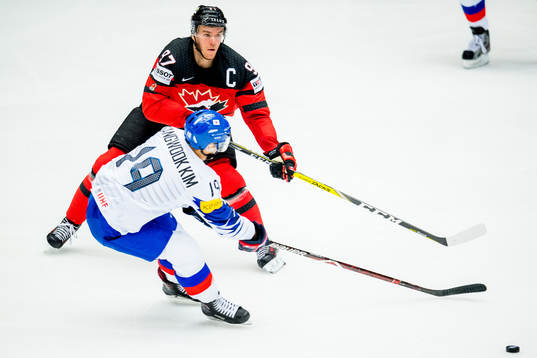 Sangwook Kim of South Korea and Connor McDavid of Canada