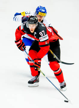 Connor McDavid of Canada and Jin Kyu Park of South Korea