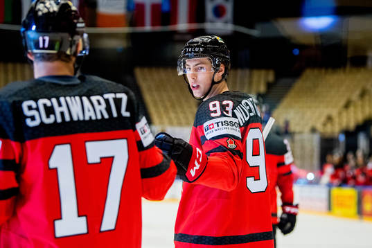 Ryan Nugent-Hopkins of Canada celebrates with teammate