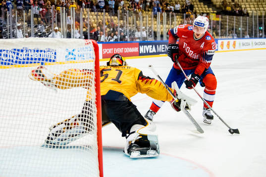 Anders Bastiansen of Norway scores