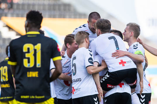 Fredrik Nordkvelle of Odd celebrate with team mates