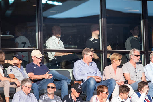 Mark Dempsey, head coach of Start, is seen behind the glass
