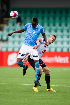 Akinsola Akinyemi of Sandnes Ulf and Ulrik Flo of Sogndal