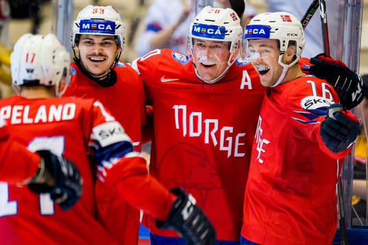 Anders Bastiansen of Norway celebrates with teammates