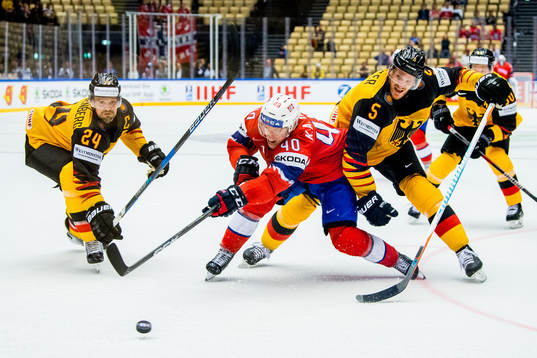 Dennis Seidenberg of Germany, Ken Andre Olimb of Norway and