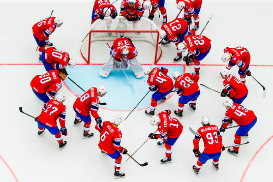Players of Norway gather around goaltender Henrik Haukeland