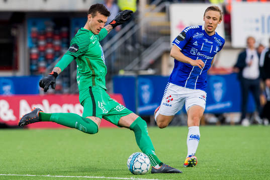 Goalkeeper Andreas Linde of Molde and Mikkel Agger of