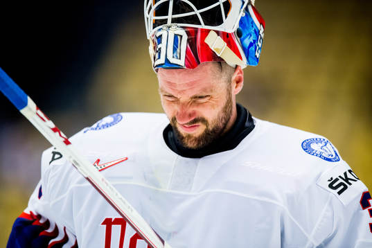 Goaltender Lars Haugen of Norway looks dejected