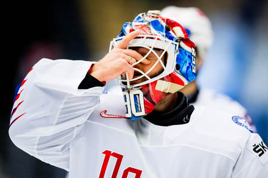 Goaltender Lars Haugen of Norway looks dejected