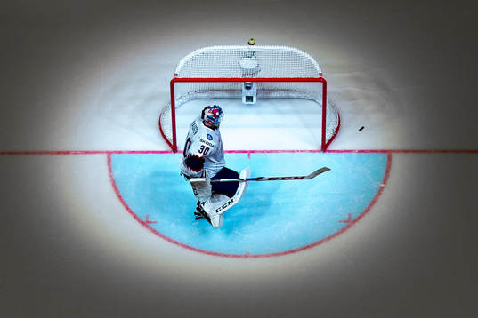 Goaltender Lars Haugen of Norway looks dejected