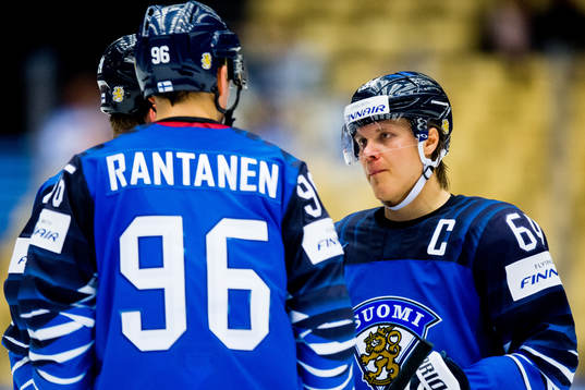 Mikael Granlund of Finland talks to his teammate Mikko
