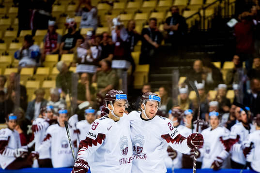 Uvis Janis Balinskis of Latvia celebrates with teammate
