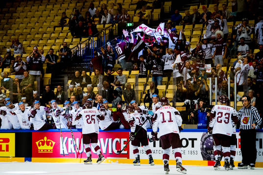 Uvis Janis Balinskis of Latvia celebrates with teammates