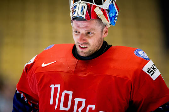 Goaltender Lars Haugen of Norway looks dejected