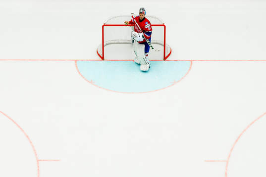 Goaltender Lars Haugen of Norway looks dejected