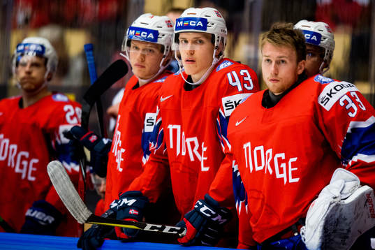 Christian Bull and goaltender Henrik Haukeland of Norway