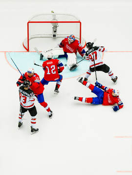 Connor McDavid of Canada scores 4-0 behind goaltender Lars