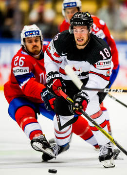 Kristian Forsberg of Norway and Pierre-Luc Dubois of Canada