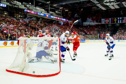 Frederik Storm of Denmark scores 3-0 behind goaltender