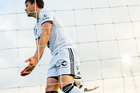 Pål André Helland and Mike Jensen of Rosenborg react