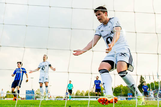 Pål André Helland and Mike Jensen of Rosenborg react