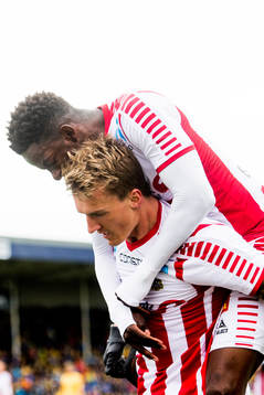 Runar Espejord and Mushaga Bakenga of Tromsø celebrate the