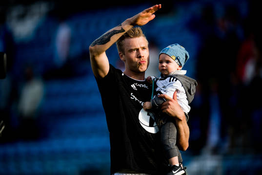 Alexander Søderlund of Rosenborg celebrates with his son