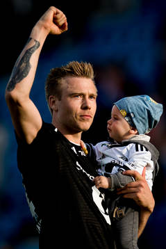 Alexander Søderlund of Rosenborg celebrates with his son