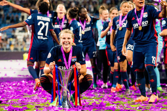 Ada Hegerberg of Lyon celebrates with the trophy