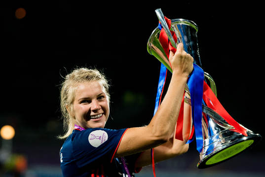 Ada Hegerberg of Lyon celebrates with the trophy