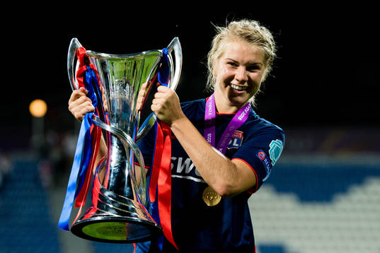 Ada Hegerberg of Lyon celebrates with the trophy