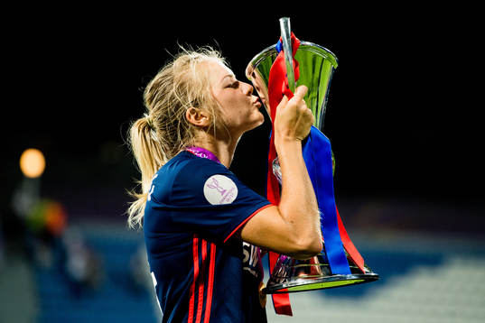 Ada Hegerberg of Lyon celebrates with the trophy